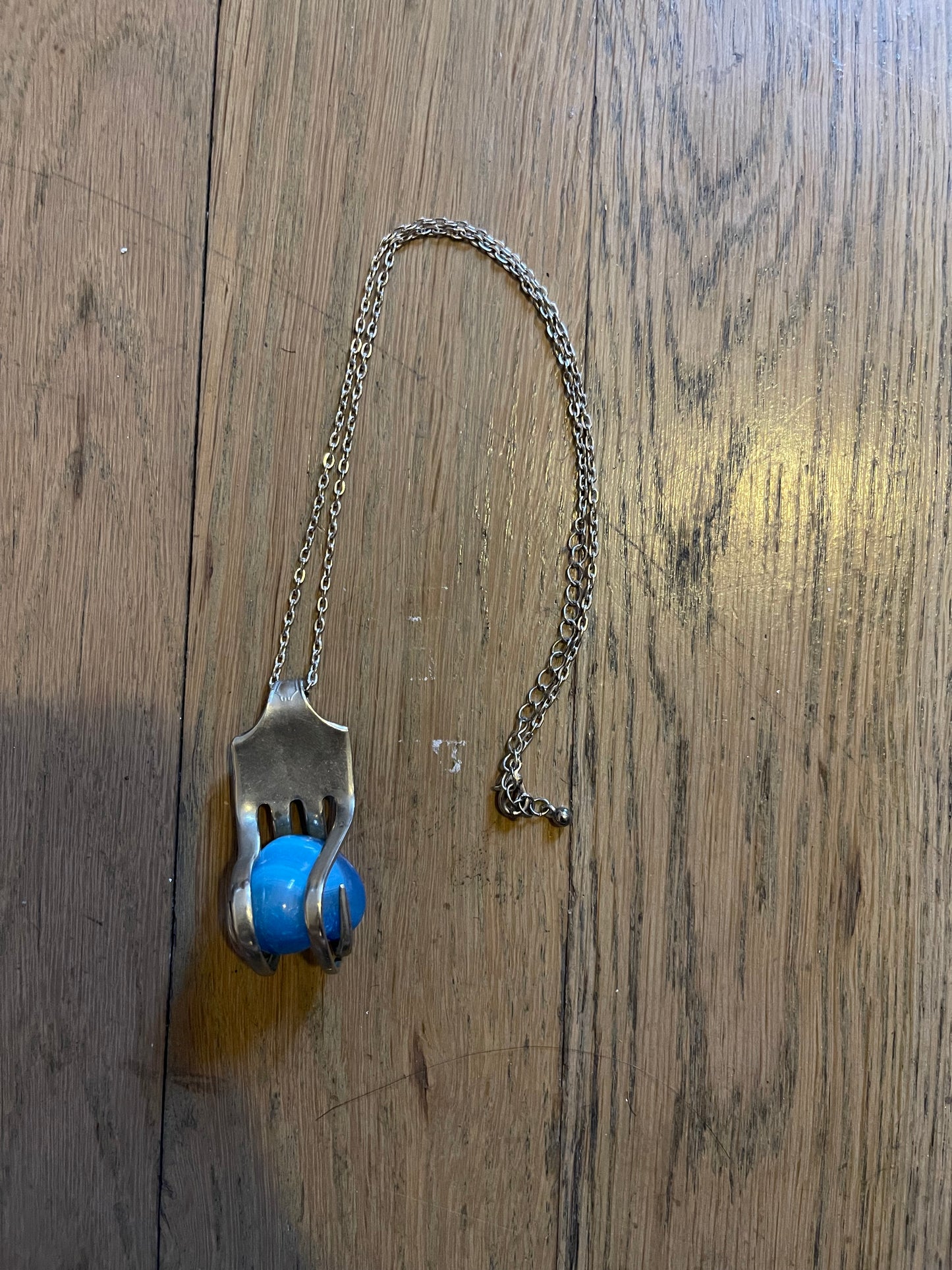 Silver fork and gem necklace
