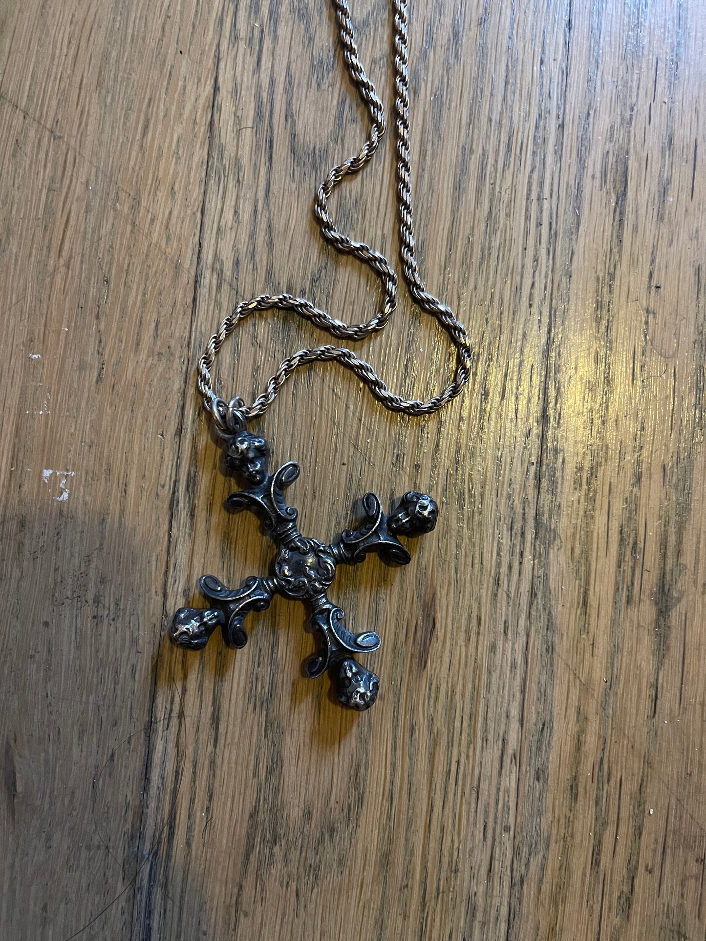 4 headed cherub cross