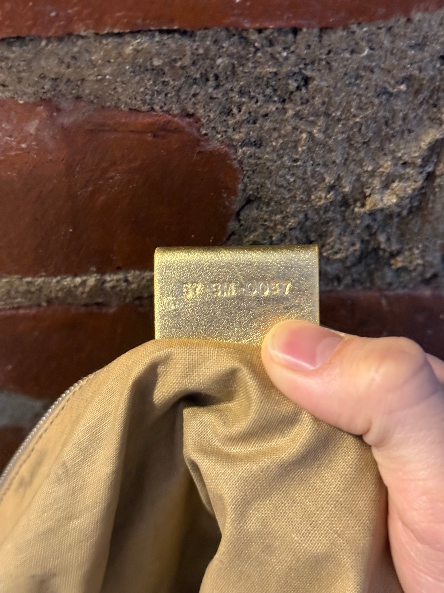 Dior Homme SS06 perforated gold leather duffle bag