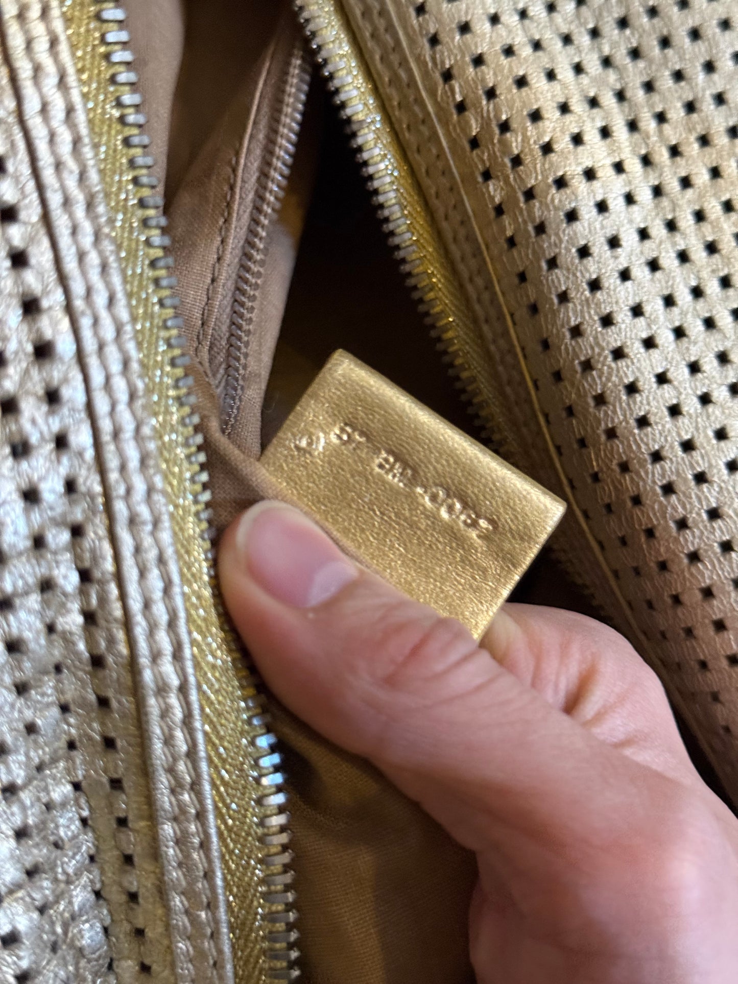Dior Homme SS06 perforated gold leather duffle bag
