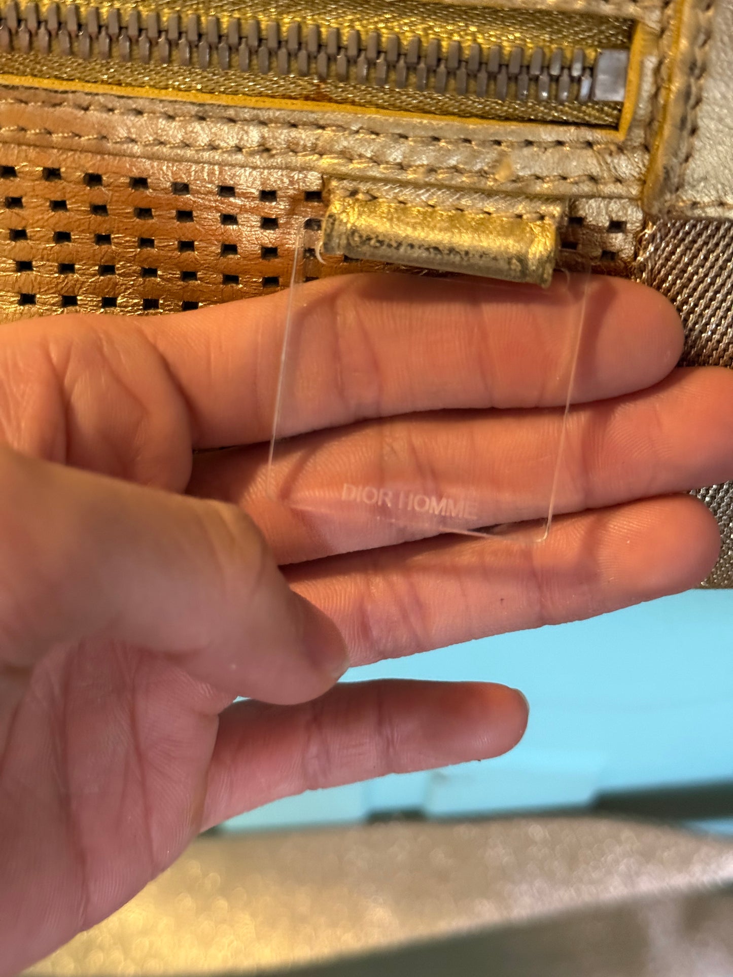 Dior Homme SS06 perforated gold leather duffle bag